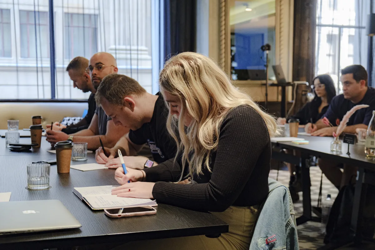 Business owners taking notes during a Kaizen session