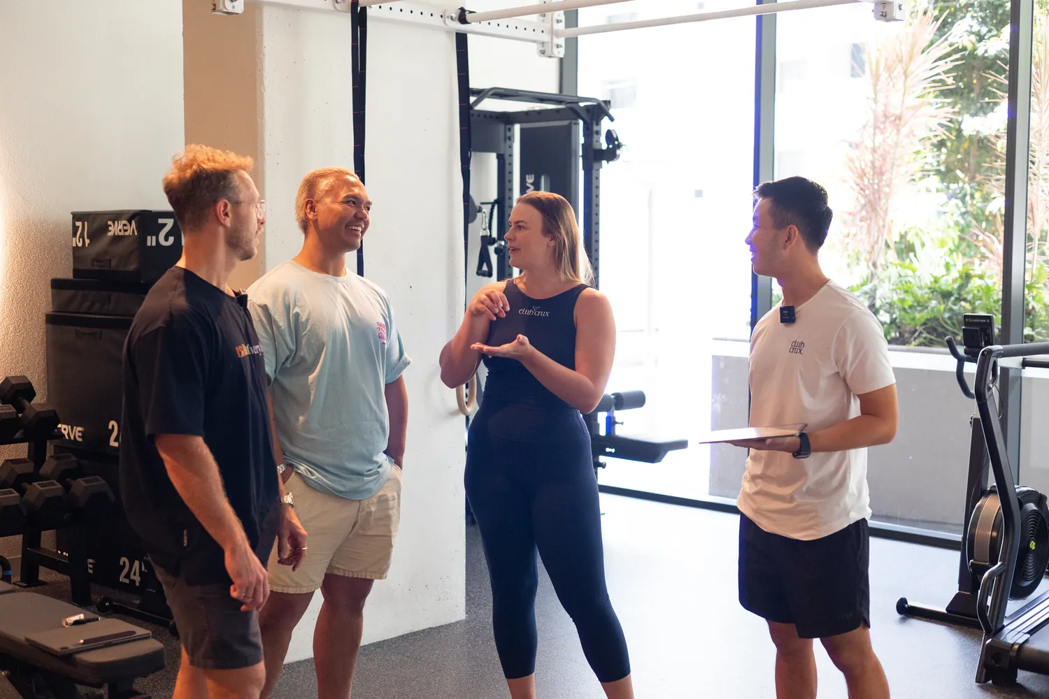 A Kaizen coach working with gym members